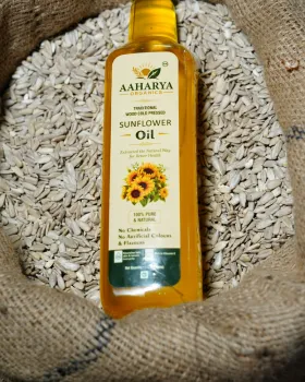 Aaharya Sunflower Oil bottle with sunflower seeds